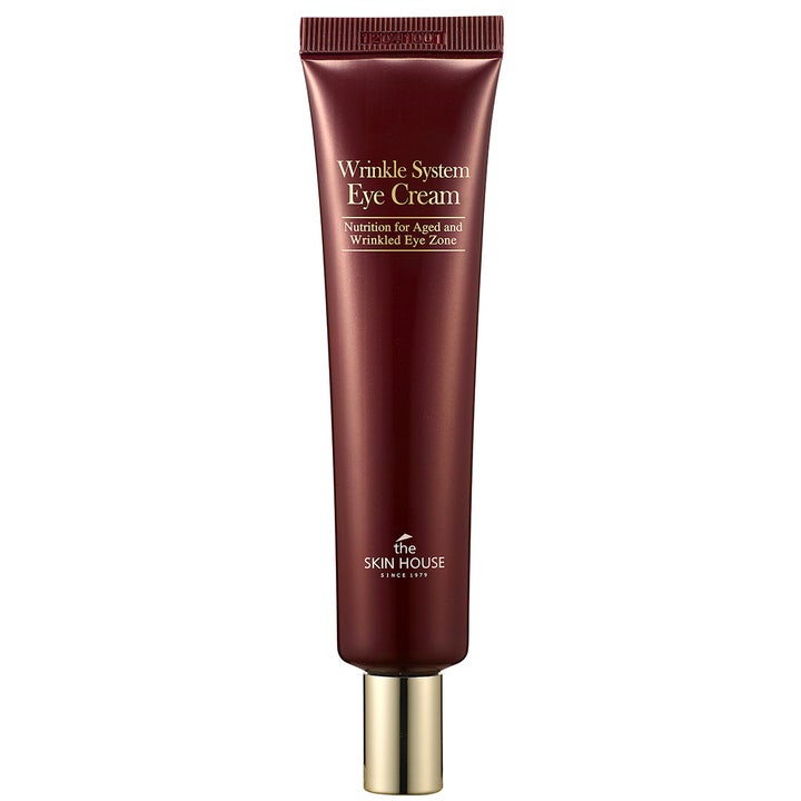 The Skin House Wrinkle System Eye Cream nærende øyekrem mot rynker i en stilren burgunderrød tube med gullfarget kork.