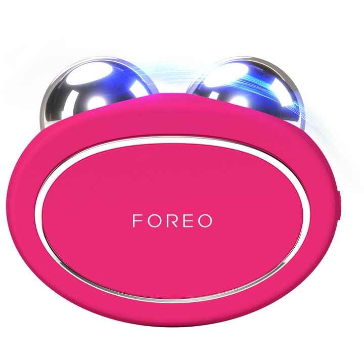 FOREO BEAR ansiktsapparat med mikrostrøm for fastere hud i fuchsia rosa silikon med to sølvkuler