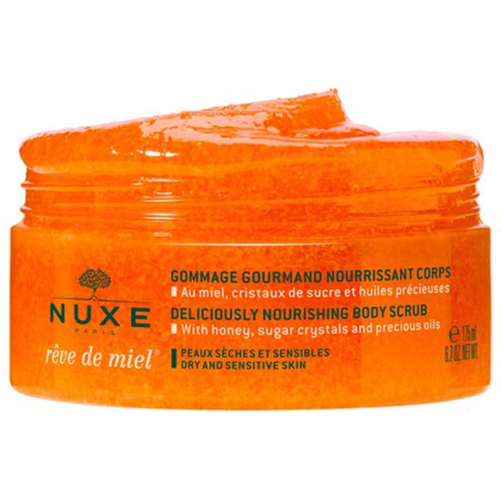 Nuxe Rêve de Miel 175 ml eksfolierende kroppsskrubb i krukke med synlig kornete oransje tekstur