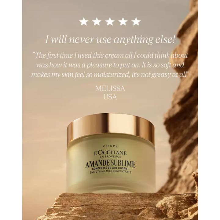 L'Occitane Almond Milk Concentrate 200 ml fuktighetskrem i glasskrukke med gullokk på en stein.