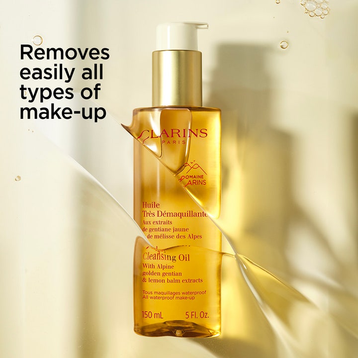 Clarins Total Cleansing Oil 150 ml ansiktsrens fjerner sminke effektivt i en gyllen pumpeflaske