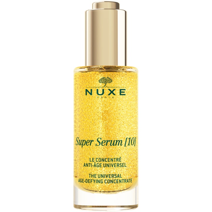 Nuxe Super Serum [10] anti-age serum som motvirker aldringstegn i glassflaske med gullkork og gylne mikrokuler.