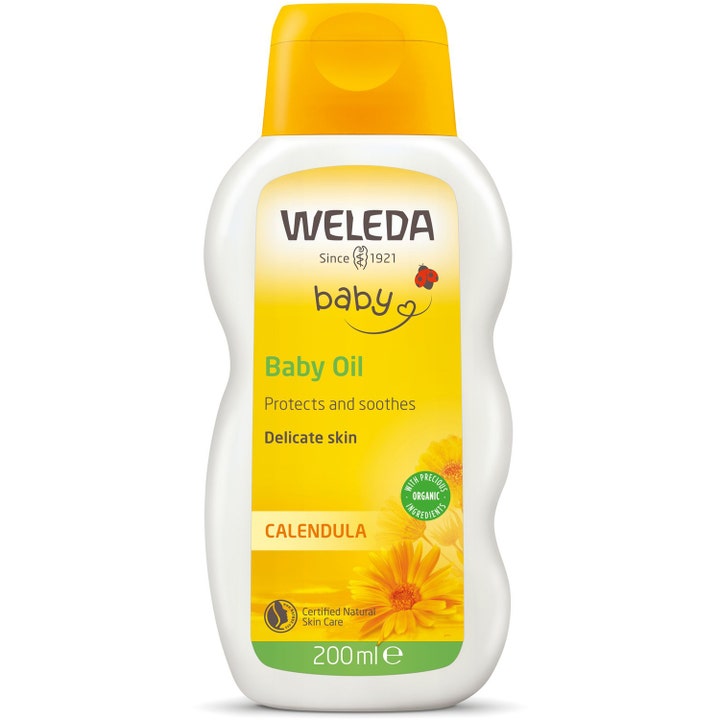 Weleda Calendula Baby Oil 200 ml gir beroligende pleie i hvit ergonomisk flaske med gult lokk og ringblomster