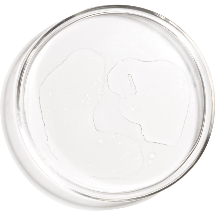 The Ordinary Glycolic Acid 7% Exfoliating Toner 240 ml eksfolierende toner gir glød med klar flytende konsistens i en skål.