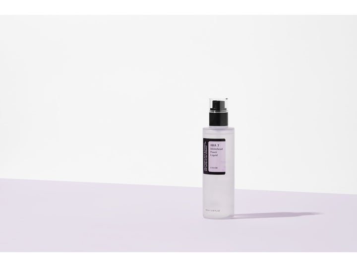 COSRX AHA 7 Whitehead Power Liquid 100 ml eksfolierende toner i frostet flaske med sort pumpe