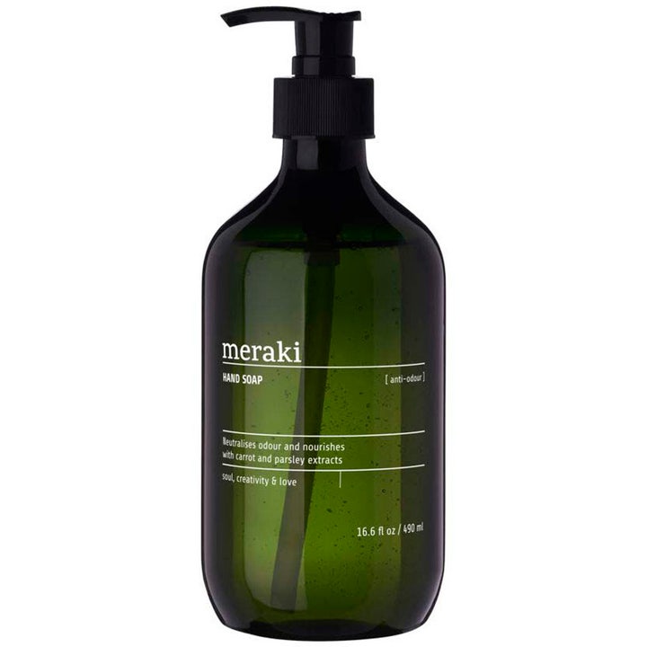 Meraki Hand Soap 490 ml nøytraliserer lukt og pleier i en mørkegrønn transparent flaske med svart pumpe