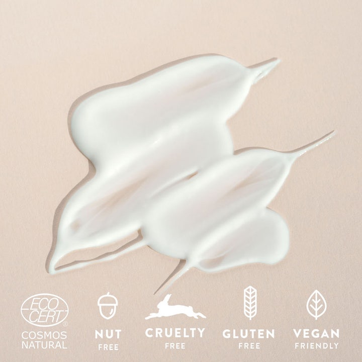 MÁDARA Hydra Soft Body Lotion 250 ml fuktighetsgivende hvit tekstur med Eco Cert og Vegan Friendly symboler