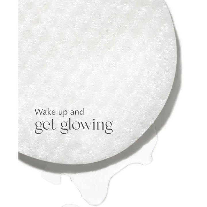 Exuviance SkinRise Morning Glow 36 stk pads gir glød og viser en hvit teksturert pad med teksten Wake up and get glowing