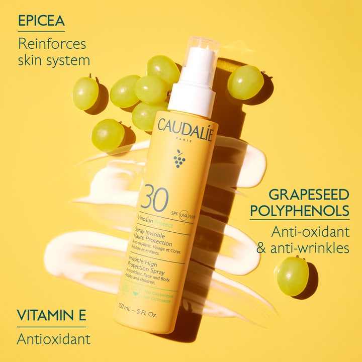 Caudalie Vinosun High Protection Spray SPF30 150 ml solkrem i gul flaske med grønne druer og hvit kremtekstur.