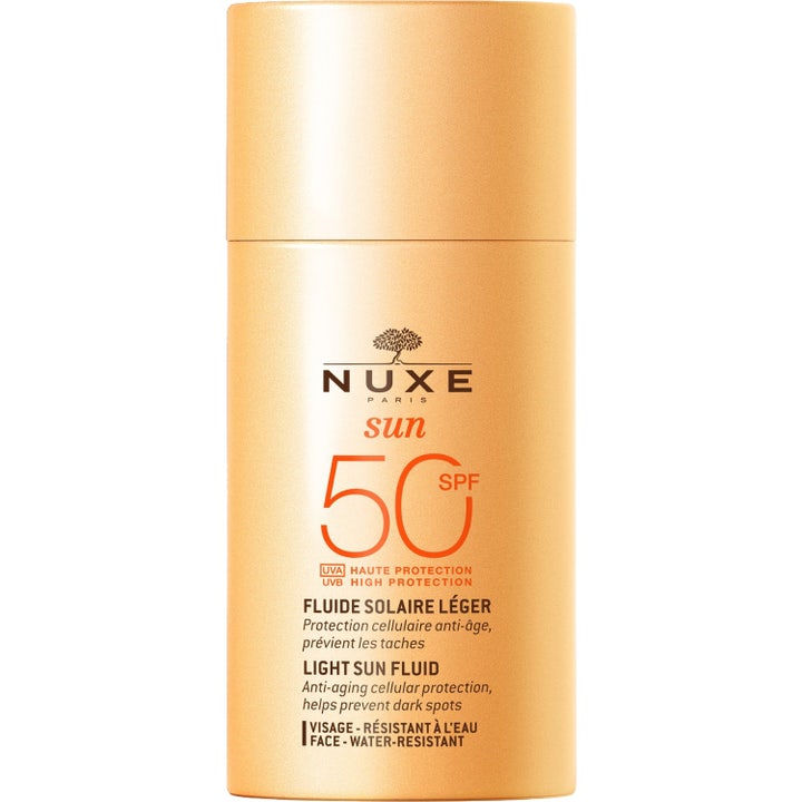Nuxe Sun Light Sun Fluid SPF 50 solkrem for ansikt som forebygger aldringstegn i en oransje sylindrisk flaske