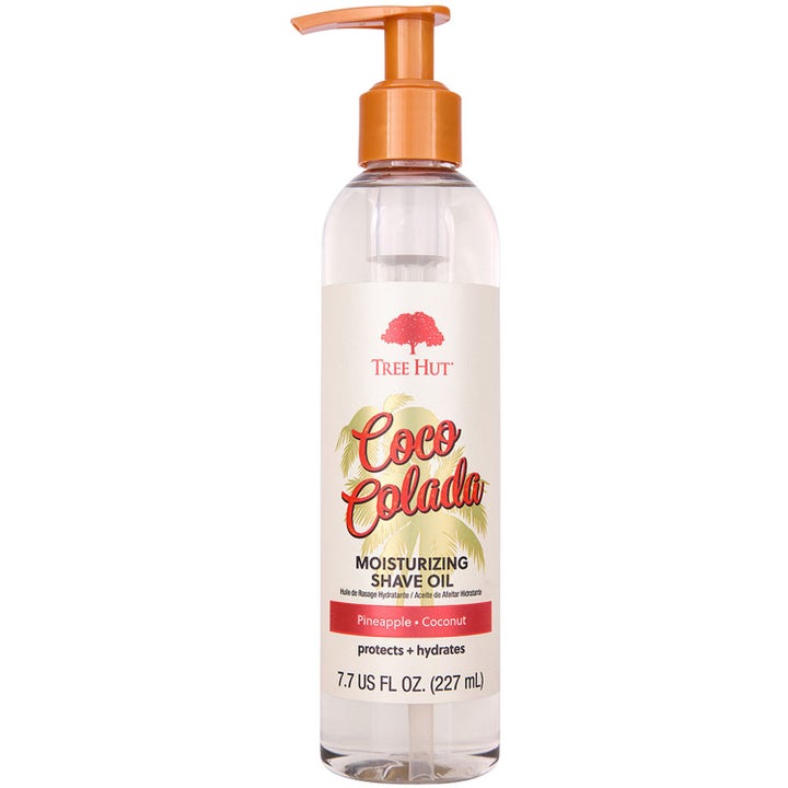 Tree Hut Coco Colada 227 ml fuktighetsgivende barberolje i gjennomsiktig plastflaske med oransje pumpe.