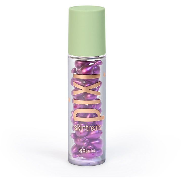Pixi Skintreats 30 Capsules hudpleie i klar flaske med lilla kapsler og lysegrønt lokk.
