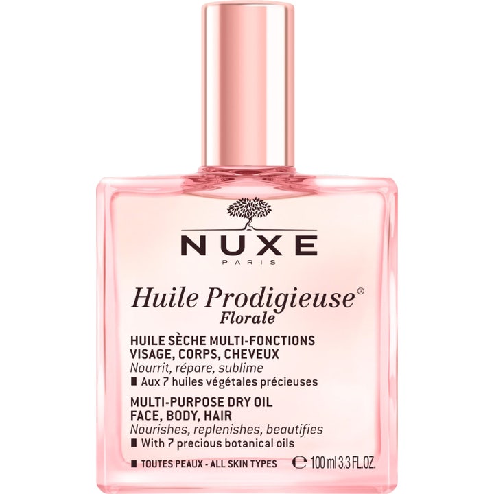 Nuxe Huile Prodigieuse Florale 100 ml nærende tørrolje i rosa glassflaske med spraypumpe og løs metallisk kork
