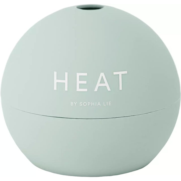 Heat by Sophia Lie The Lip Balm 15 ml fuktighetsgivende leppepleie i en mintgrønn rund krukke med matt finish.