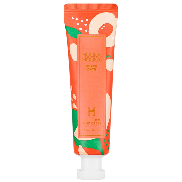 Holika Holika Peach Date 30 ml fuktighetsgivende håndkrem i fargerik orange tube dekorert med ferskenillustrasjoner