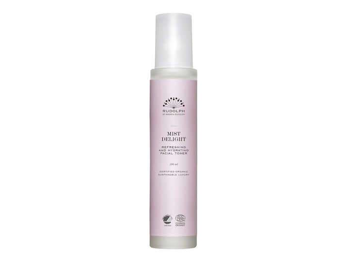 Rudolph Care Mist Delight 100 ml fuktighetsgivende ansiktsspray i en lys lilla flaske med hvit frostet kork