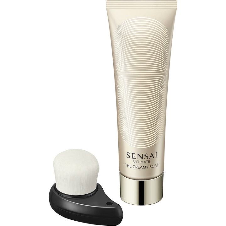 Sensai Ultimate The Creamy Soap ansiktsrens gir strålende hud i champagnefarget tube med hvit rensebørste.