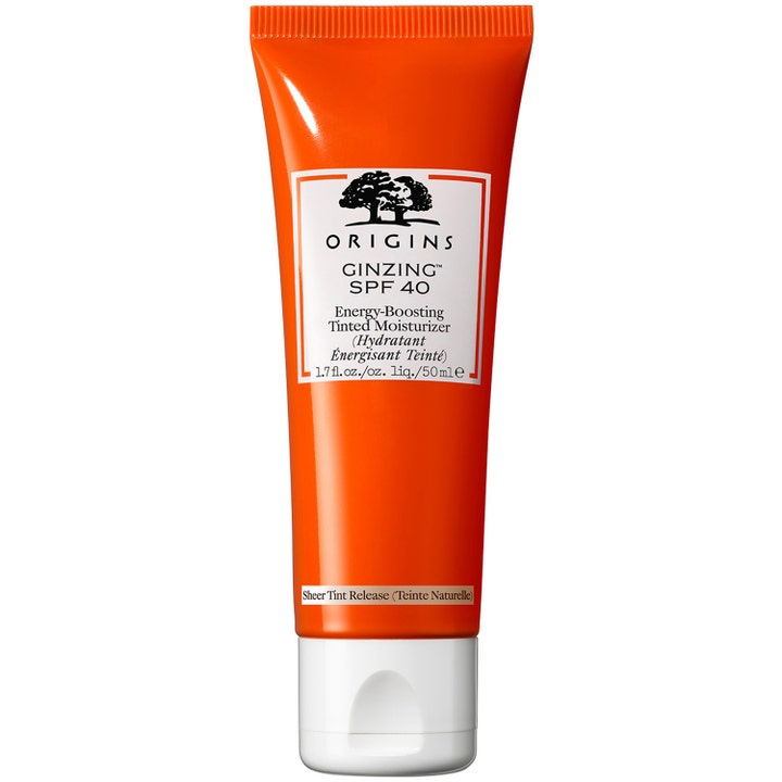 Origins GinZing SPF 40 Tinted Moisturizer 50 ml farget dagkrem som gir glød i en oransje tube med hvitt lokk
