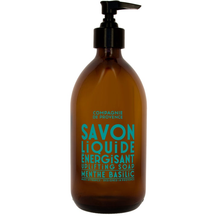 Compagnie de Provence Savon Liquide Energisant Menthe Basilic flytende såpe i brun glassflaske med svart pumpe.