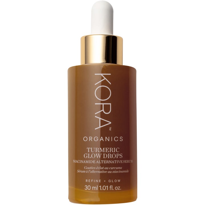 KORA Organics Turmeric Glow Drops 30 ml glødgivende serum i brun glassflaske med gulldetaljer og hvit pipette.