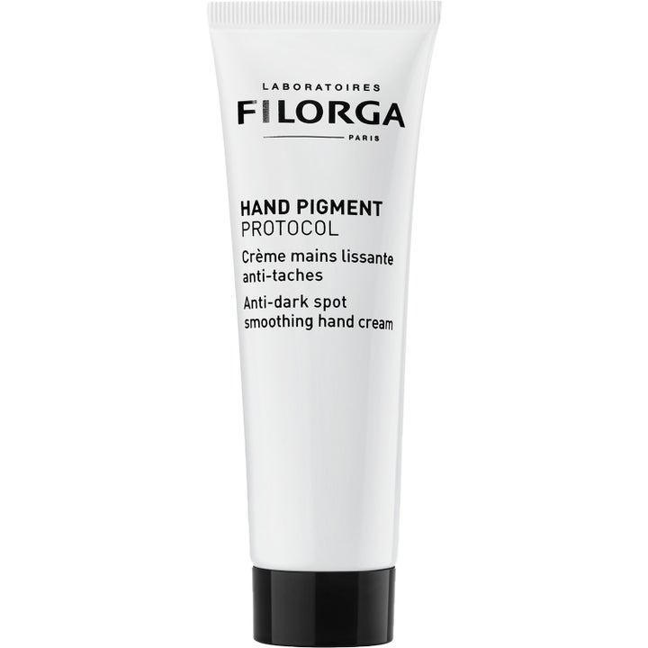 Filorga Hand Pigment Protocol utjevnende håndkrem mot pigmentflekker i hvit tube med svart skrukork og ren tekst.