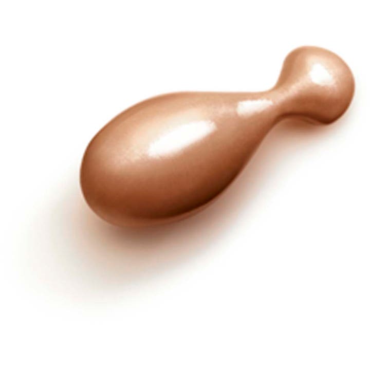 Clarins Milky Boost Capsules 06 7,8 ml glødgivende serum som en dråpeformet bronsefarget kapsel.