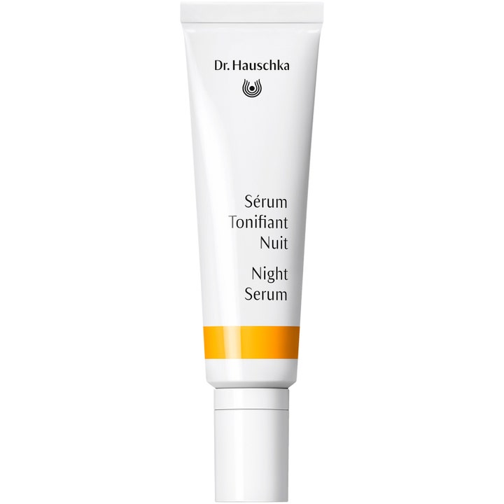 Dr. Hauschka Night Serum revitaliserende nattserum i hvit tube med en klar oransje stripe og hvit kork.