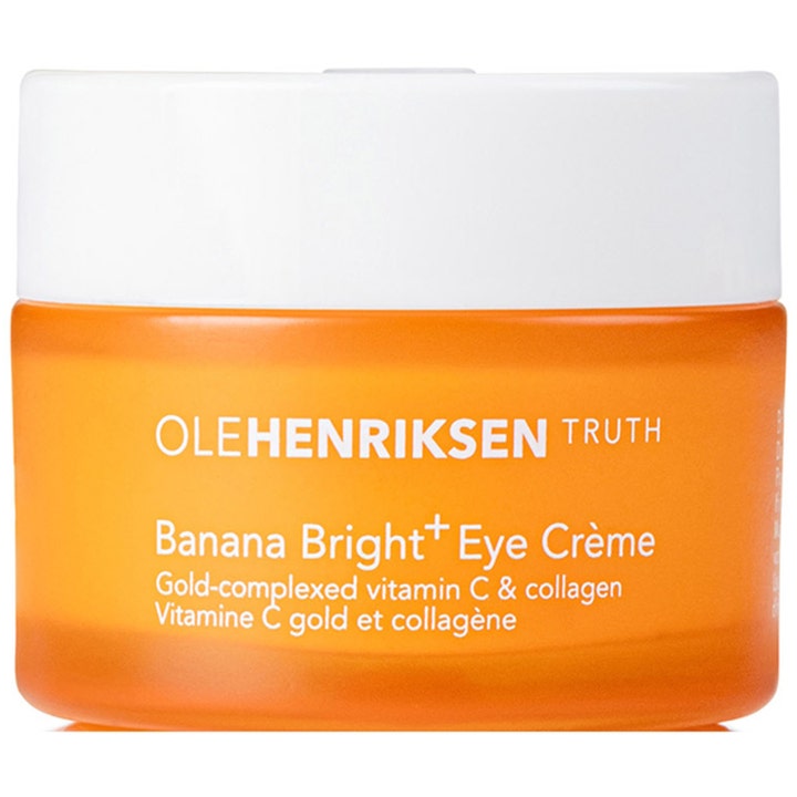 OleHenriksen Banana Bright+ Eye Crème lysnende øyekrem med vitamin C i en frostet oransje krukke med hvitt lokk