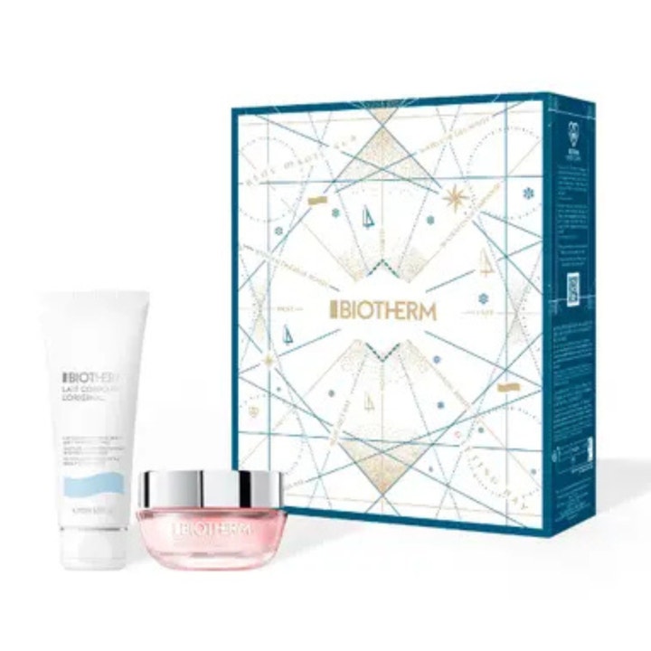 Biotherm Holiday hudpleiesett for fuktighet med hvit tube og rosa glasskrukke foran dekorativ gaveeske