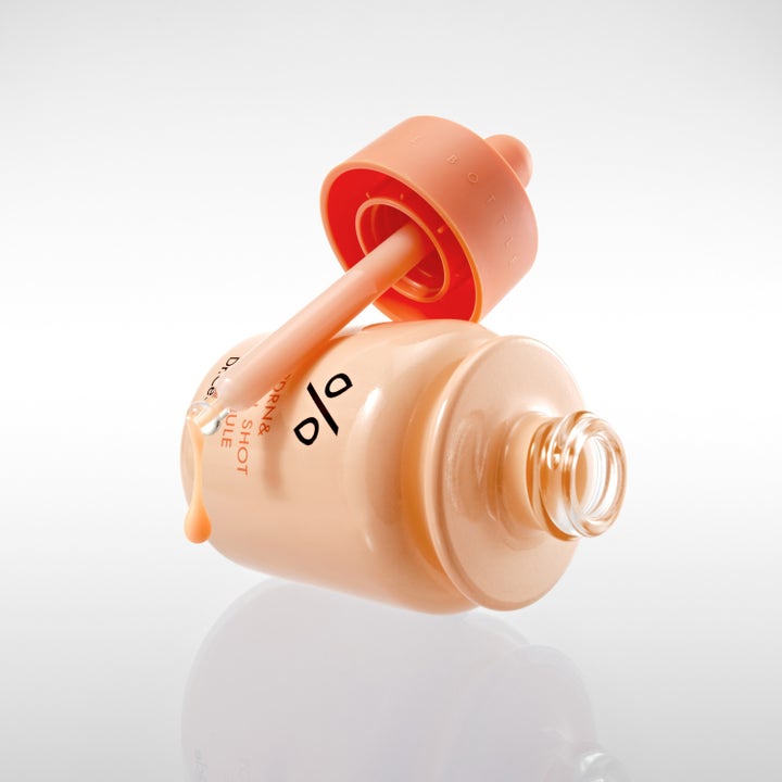 Dr. Ceuracle PDRN & Retinol Shot Ampoule 30 ml fornyende serum i ferskenfarget flaske med dråpe fra pipette.