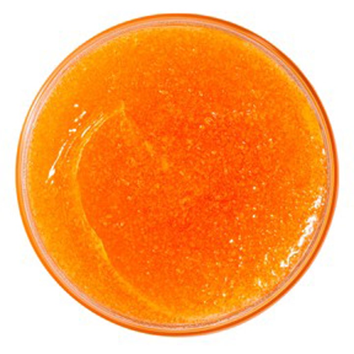 Nuxe Rêve de Miel Body Scrub 175 ml eksfolierende kroppsskrubb med en kornete oransje tekstur i krukke