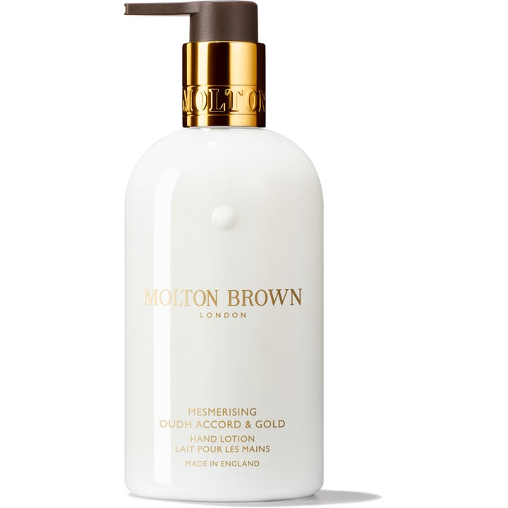 Molton Brown Mesmerising Oudh Accord & Gold 300 ml fuktighetsgivende håndlotion i hvit pumpeflaske med gulldetaljer