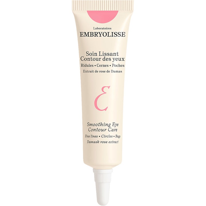 Embryolisse Smoothing Eye Contour Care 15 ml utglattende øyekrem som motvirker mørke ringer i beige tube med rosa detaljer.