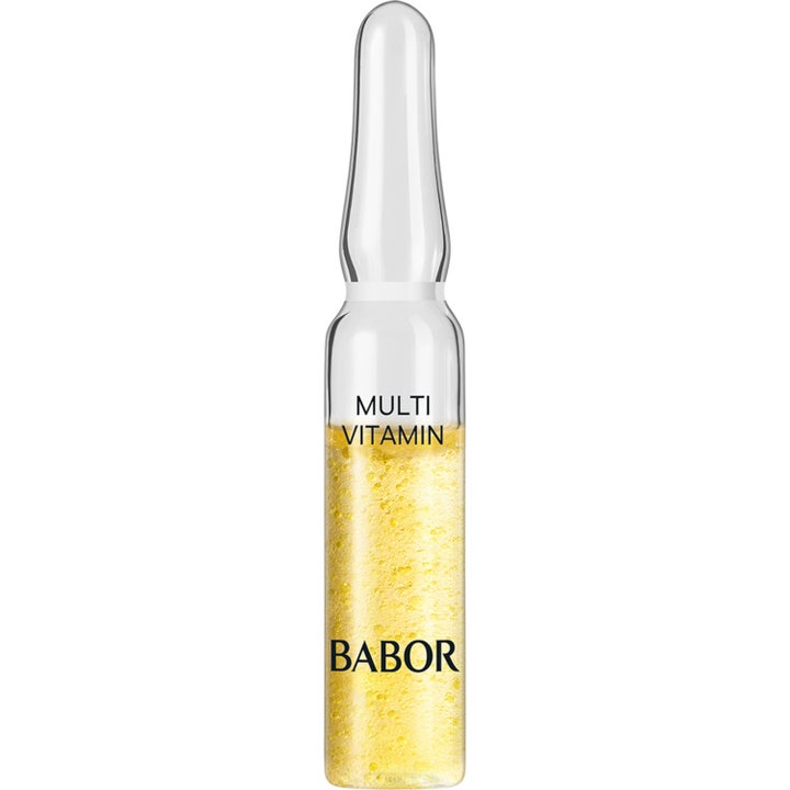 Babor Multi Vitamin 2 ml glødgivende serum i en klar glassampulle fylt med en boblende gul konsistens.
