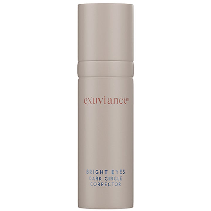 Exuviance Daily Eye Smoother 15 g fuktighetsgivende øyekrem i beige sylinderformet pumpeflaske
