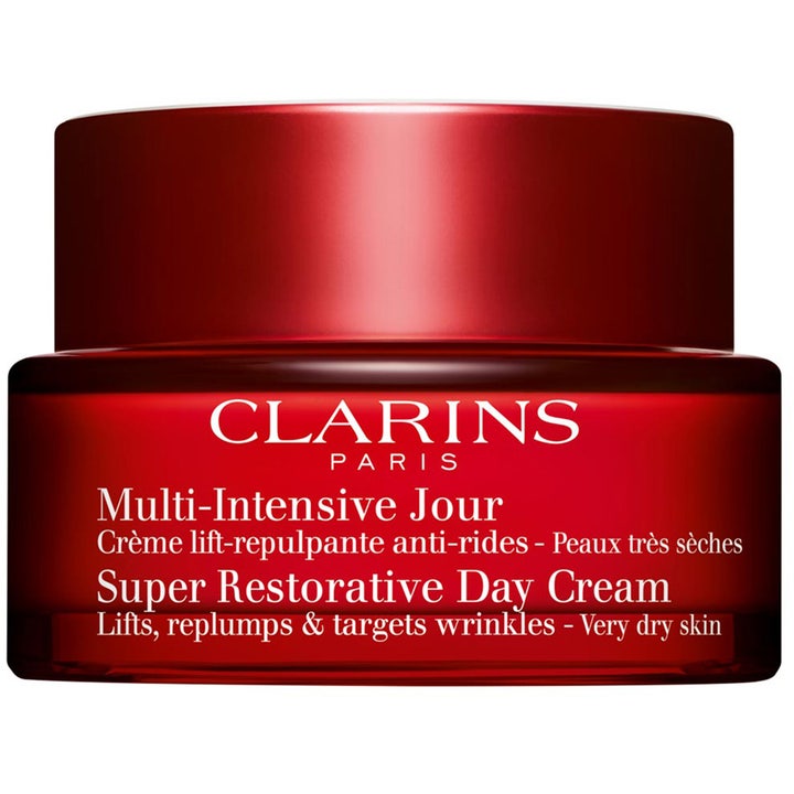 Clarins Super Restorative Day Cream oppstrammende dagkrem som gir fylde i en rød glasskrukke med matchende rødt lokk