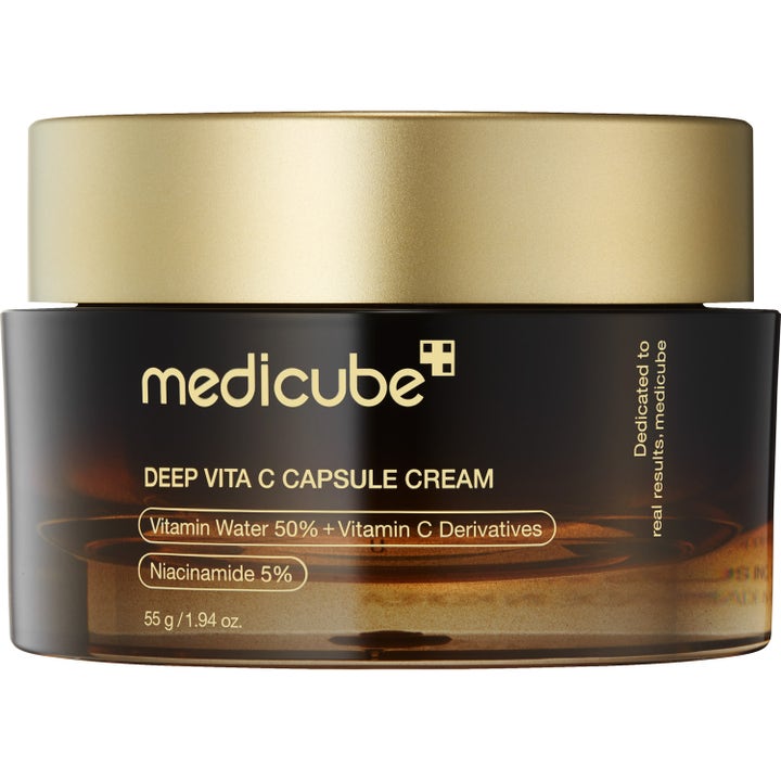 Medicube Deep Vita C Capsule Cream 55 g opplysende ansiktskrem med vitamin C og niacinamide i mørk glasskrukke med gulllokk