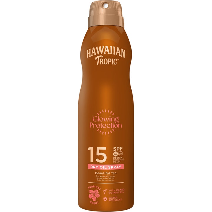 Hawaiian Tropic Glowing Protection Dry Oil Spray 200ml solbeskyttelse i en brun konturert flaske med spraytopp