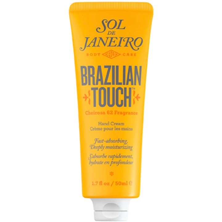 Sol de Janeiro Brazilian Touch 50 ml fuktighetsgivende håndkrem i en gul tube som absorberes raskt og gir myk hud.