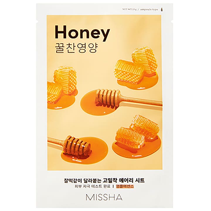 Missha Airy Fit Sheet Mask Honey 19g næringsgivende arkmaske i hvit pose dekorert med gyllen honning og vokskaker