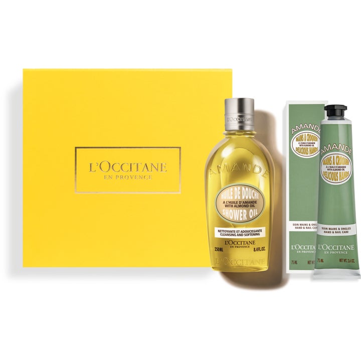 L'Occitane Amande Gavesett med fuktighetsgivende dusjolje og håndkrem ved en gul gaveeske