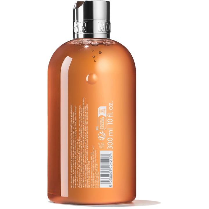 Molton Brown Sunlit Clementine & Vetiver 300 ml dusjsåpe i klar flaske med oransje gel sett fra baksiden