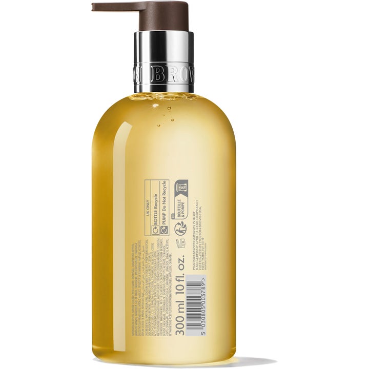 Molton Brown Flora Luminare Fine Liquid Hand Wash 300 ml håndsåpe viser baksiden av flasken med ingrediensliste.