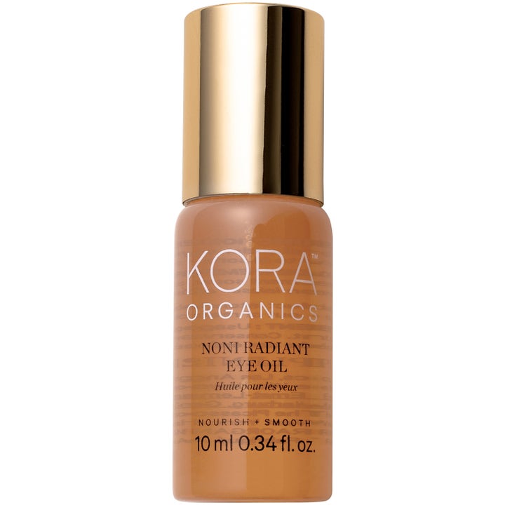 Kora Organics Noni Radiant Eye Oil 10 ml nærende øyeolje som glatter ut i en gyllen glassflaske med gullkork.
