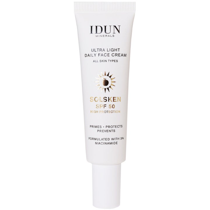 IDUN Minerals Solsken Ultra Light Daily Face Cream SPF 50 beskyttende ansiktskrem med niacinamid i hvit tube med gulldetaljer