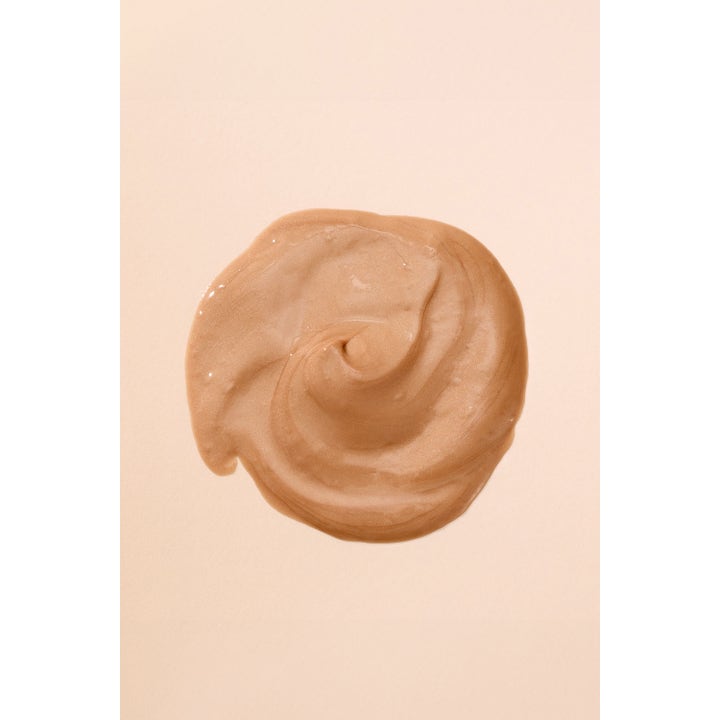 Hickap Honey Glow Priming Moisturizer 50 ml fuktighetskrem med en glitrende, gyllen og kremet tekstur som gir glød.