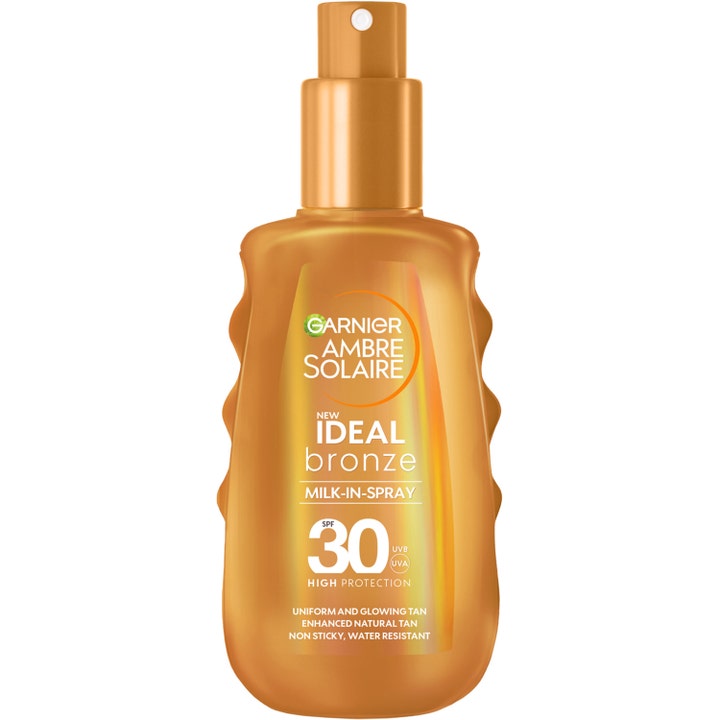Garnier Ambre Solaire Ideal Bronze Milk-in-Spray SPF 30 solkrem gir glød i en gyllen flaske med spraypumpe.
