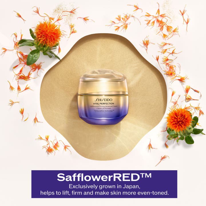 Shiseido Vital Perfection Advanced Day Cream 50 ml oppstrammende ansiktskrem i gullkrukke med saflorblomster.