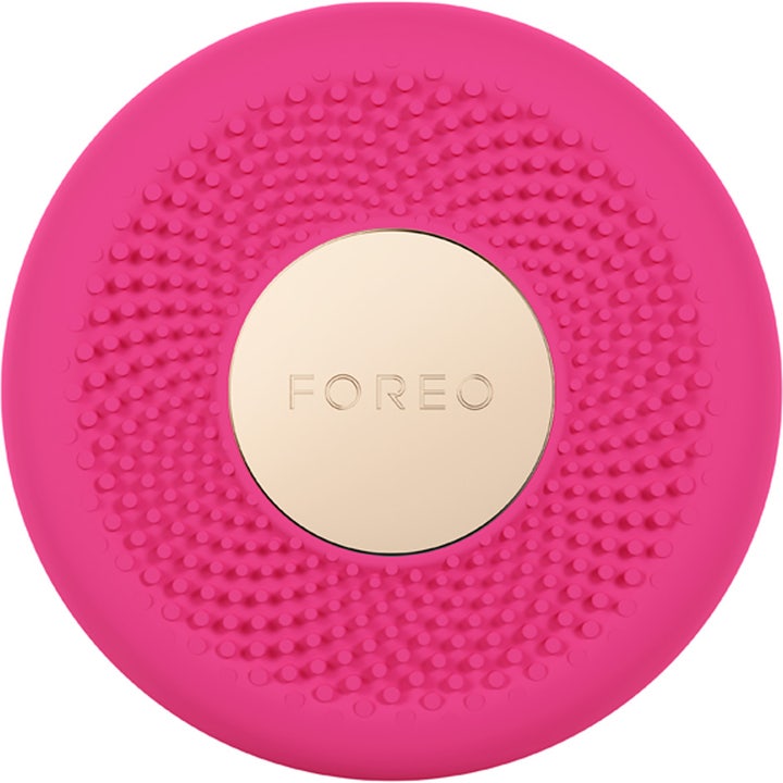 FOREO UFO 3 mini Fuchsia 1 stk hudpleieenhet gir fuktighet med fuchsia silikonnupper og gullfarget detalj.