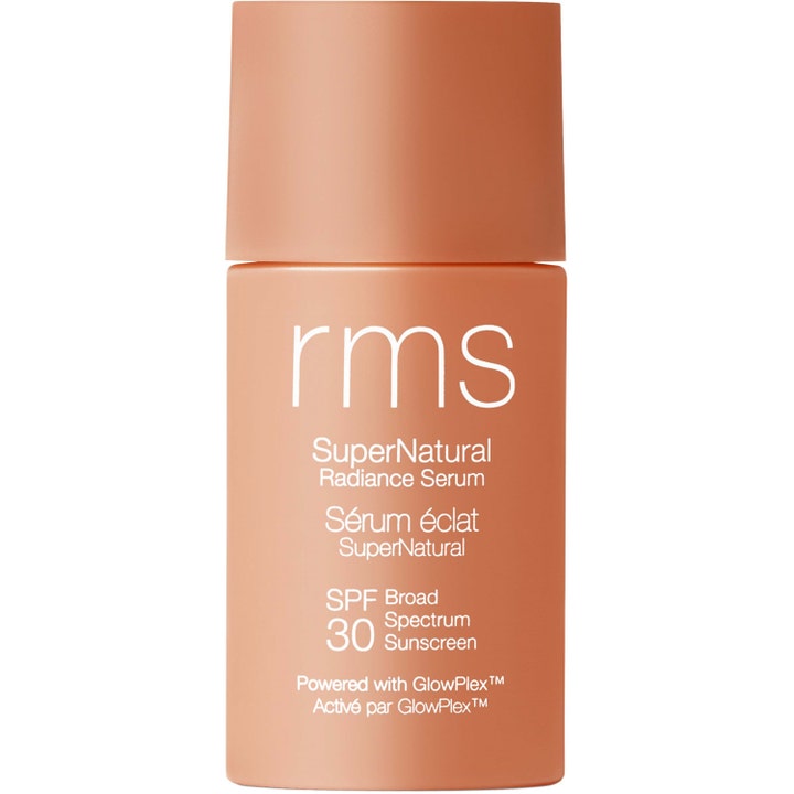 RMS SuperNatural Radiance Serum SPF 30 solbeskyttende serum som gir glød i en matt ferskenfarget sylindrisk flaske